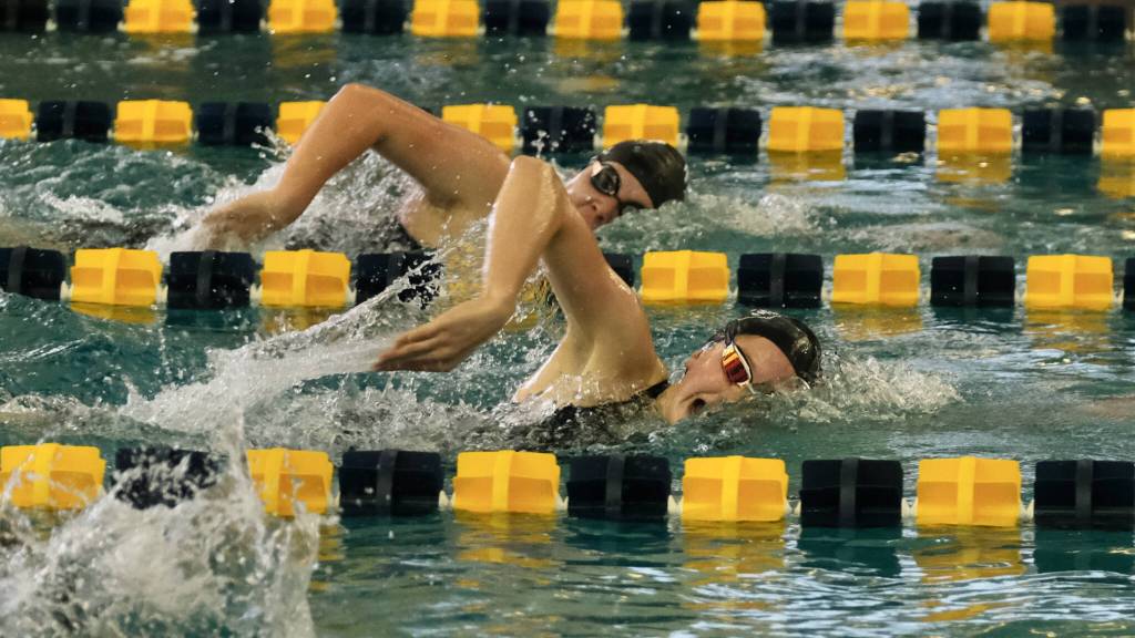 Juneau-Douglas High School: Yadaa.at Kalé sophomore Valerie Peimann leads Thunder Mountain freshman Amy Liddle in the girls 500 freestyle during the ASAA State Swim & Dive Championships on Saturday at the Dimond Park Aquatic Center. (Klas Stolpe / For the Juneau Empire)