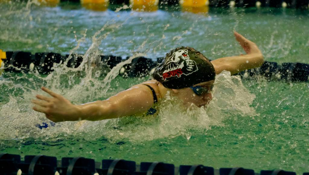 Juneau-Douglas High School: Yadaa.at Kalé junior Lucia Chapell swims the butterfly leg of the Crimson Bears winning 200-yard medley relay during the ASAA State Swim & Dive Championships on Saturday at the Dimond Park Aquatic Center. (Klas Stolpe / For the Juneau Empire)