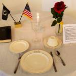 A table setting is laid out on the Missing Man Table during an annual Veterans Day lunchtime gathering at American Legion Auke Bay Post 25 on Saturday. (Mark Sabbatini / Juneau Empire)