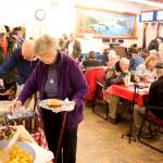 Military veterans, family members and others gather at American Legion Auke Bay Post 25 at midday Saturday for an annual Veterans Day lunchtime gathering. (Mark Sabbatini / Juneau Empire)