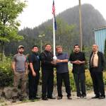 Friends and family of Greg Bowen hold his ashes on the day of his service in 2019. The ashes were spread at the seine hooks Greg mastered and other spots he loved, said Barbara Nelson. From left to right, Bill Peters, Matt See, Nicholas Nelson, Norval Nelson, Wade Bowen, Michael Corpuz. (Photo courtesy of Barbara Cadiente-Nelson.)