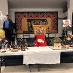 The table set up for the service of Greg Bowen on July 12, 2019, at Juneau Tlingit & Haida Community Center included trophies and mementos from other aspects of life. (Photo courtesy of Barbara Cadiente-Nelson.)