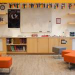 A row of rainbow flags are displayed above the bookshelves in the teen room at the Mendenhall Valley Public Library. (Mark Sabbatini / Juneau Empire)
