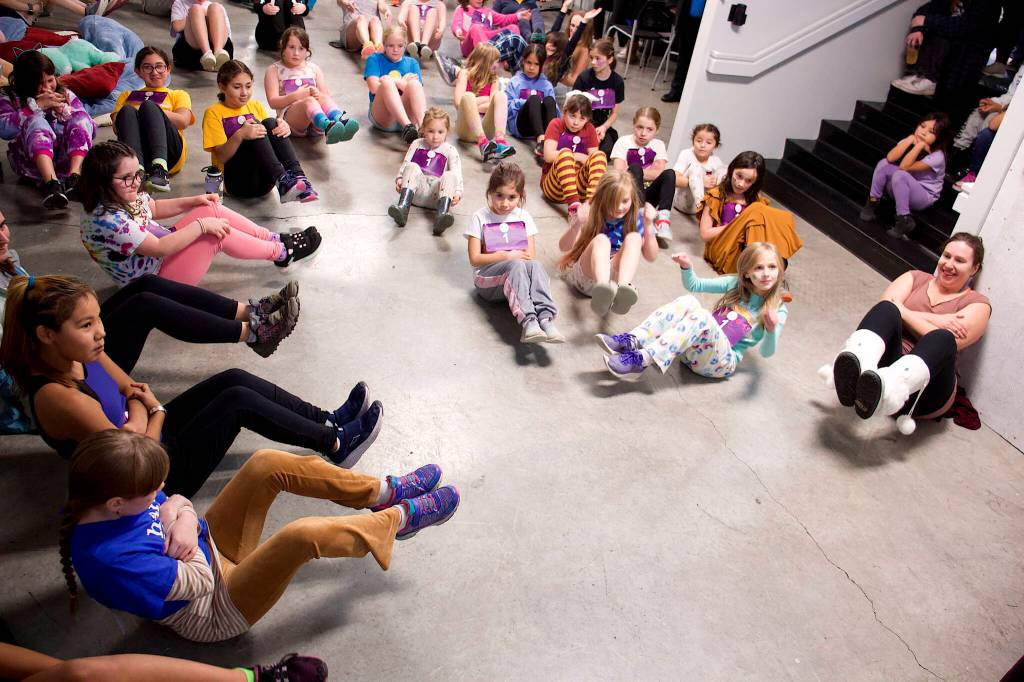 Mark Sabbatini / Juneau Empire
Juneau Girls on the Run participants go through a series of stretching and warmup exercises before the 5K Pajama Jog at Dimond Park Field House on Sunday afternoon.