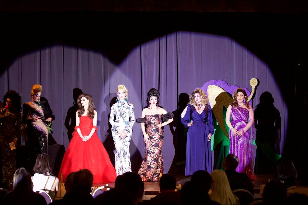 The five contestants in the Miss Gay Alaska America pageant line up on stage to hear the results from the judges at the end of the two-night event Saturday at the Juneau Arts and Culture Center. The stage names of the competitors were Miss Guise of Juneau, Osha Violation of Fairbanks, Dyanne Dystopia of Juneau, Lamia Monroe of Anchorage and Diamond Monroe of Juneau. (Mark Sabbatini / Juneau Empire)