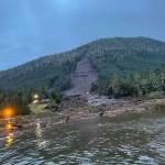 Emergency response officials investigate the area where a landslide hit three homes and killed one person in Wrangell on Monday night, with a search ongoing Tuesday for other people presumed missing. (Alaska Department of Transportation and Public Facilities)