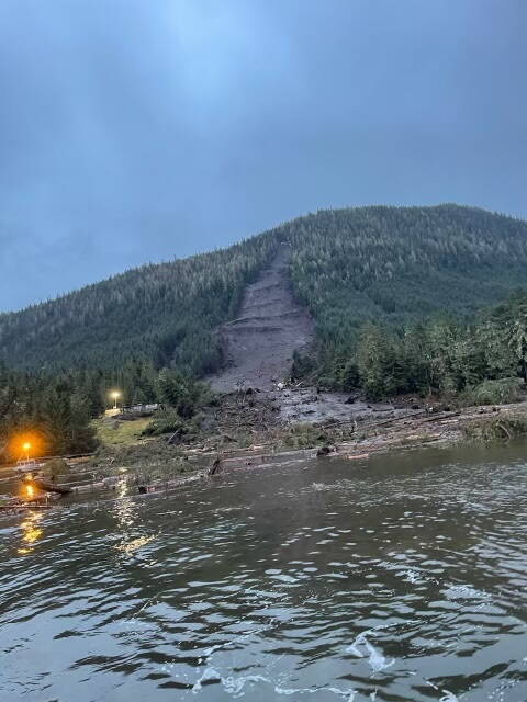 Emergency response officials investigate the area where a landslide hit three homes and killed one person in Wrangell on Monday night, with a search ongoing Tuesday for other people presumed missing. (Alaska Department of Transportation and Public Facilities)