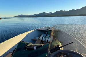 The author guides his skiff in the direction of muskegs free from digital connectivity, but there is no escaping thoughts of contemporary life. (Photo by Jeff Lund)