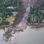 This image from video provided by Sunrise Aviation shows the landslide that occurred the previous evening near Wrangell on Monday. Authorities said at least one person died and others were believed missing after the large landslide roared down a mountaintop into the path of three homes. (Sunrise Aviation via AP)