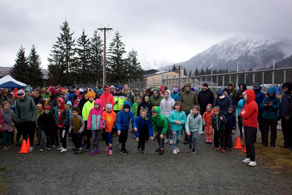 Dozens of people get ready to burn off calories before their Thanksgiving dinner at the start of the annual Turkey Trot 5K and 1 Mile Fun Run at the Airport Dike Trail on Thursday. (Mark Sabbatini / Juneau Empire)