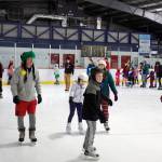 Hundreds of people pack into Treadwell Arena on Friday night for the annual Santa Skate. (Mark Sabbatini / Juneau Empire)