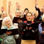 Choir members rehearse Tuesday night for a Bach holiday concert at Ḵunéix̱ Hídi Northern Light United Church. (Mark Sabbatini / Juneau Empire)