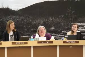 Angie Flick (center), finance director for the City and Borough of Juneau, provides details of an early draft of next years municipal budget to Assembly members as City Manager Katie Koester (left) and Budget Manager Adrien Wendel listen during a Finance Committee meeting Wednesday night in the Assembly Chambers. (Mark Sabbatini / Juneau Empire)