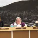 Angie Flick (center), finance director for the City and Borough of Juneau, provides details of an early draft of next years municipal budget to Assembly members as City Manager Katie Koester (left) and Budget Manager Adrien Wendel listen during a Finance Committee meeting Wednesday night in the Assembly Chambers. (Mark Sabbatini / Juneau Empire)