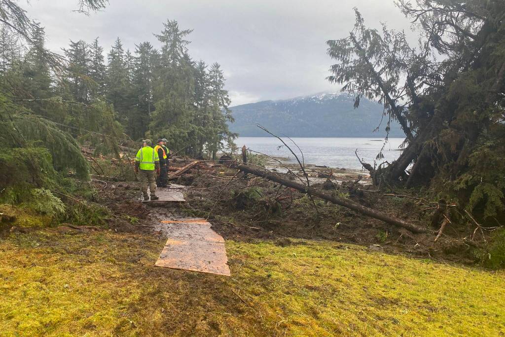 Search and rescue officials examine the area about 11 miles south of the center of Wrangell where a landslide occurred on Nov. 20. Five people are confirmed dead from the landslide and one still missing. (Photo courtesy of Alaska Department of Public Safety)