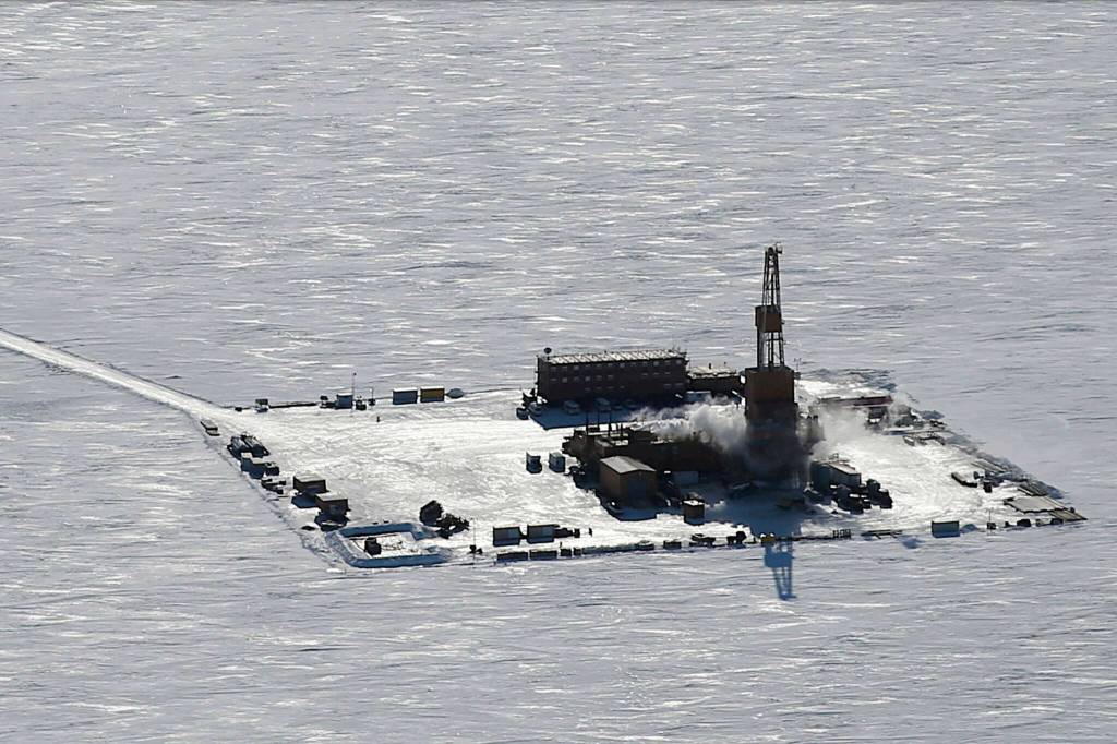 A ConocoPhillips oil rig operating during winter on Alaskas North Slope is featured on the cover of the U.S. Bureau of Land Managements report recommending approval of the Willow oil project. (U.S. Bureau of Land Management)