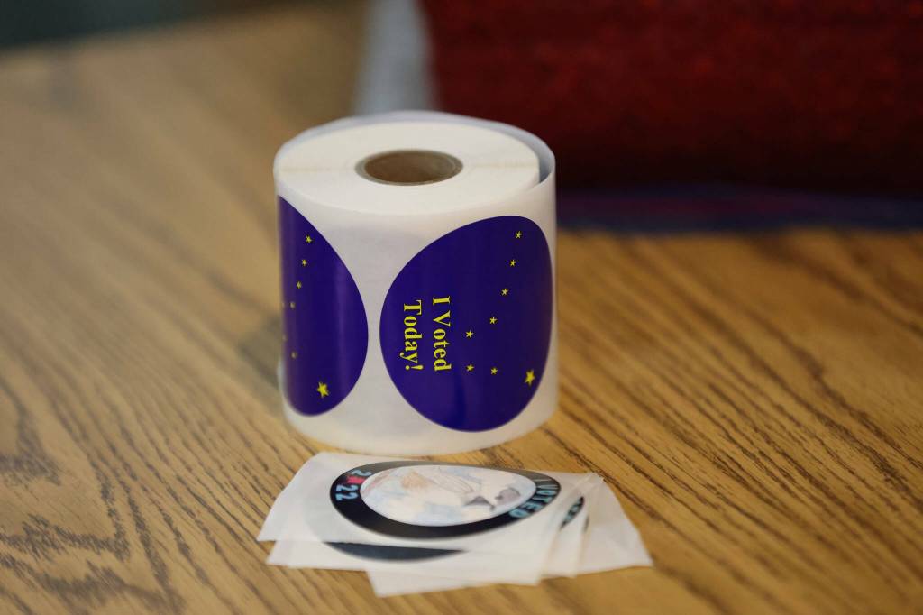 I voted stickers await voters on Election Day 2022, the first regular general election in Alaska to include ranked choice voting. A petition to repeal such voting is now circulating, with an organization supporting it the target of a complaint filed this week. (Ben Hohenstatt / Juneau Empire file photo)