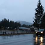 A car drives by Mendenhall River Community School on Back Loop Road on Thursday morning. (Mark Sabbatini / Juneau Empire)