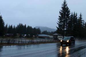 A car drives by Mendenhall River Community School on Back Loop Road on Thursday morning. (Mark Sabbatini / Juneau Empire)