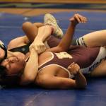 Thunder Mountain High School freshman Camden Messmer pins Ketchikan sophomore RJ Cadiente in their 112-pound semifinal match of the 2023 Region V Wrestling Championships on Friday at TMHS. (Klas Stolpe / For the Juneau Empire)