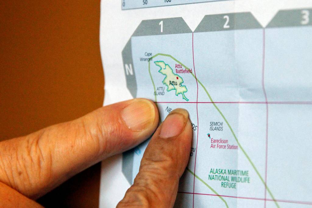 Pauline Golodoff and George Kudrin point to Attu Island, the most westerly in the Alaskas Aleutian Islands, on a map, Friday, Dec. 1, 2023, in Anchorage, Alaska. Their deceased spouses, Gregory Golodoff and Elizabeth Golodoff Kurduin, were the last two living residents of Attu, Alaska, whose entire population was captured by the Japanese during World War II and sent to Japan until being liberated after the war. The community of Attu was not rebuilt, and residents were resettled elsewhere, mostly in Atka, Alaska. (AP Photo/Mark Thiessen)