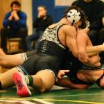 Thunder Mountain High School junior Justus Darbonne works to turn TMHS sophomore Alex Marx-Beierly in the 152-pound Division I championship match of the 2023 ASAA Region V wrestling tournament Saturday at TMHS. Darbonne won by 12-1 major decision. (Klas Stolpe/ For the Juneau Empire)