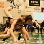 Thunder Mountain High School grappler Jed Davis, a Juneau-Douglas High School: Yadaa.at Kalé freshman, takes down Ketchikan High School sophomore Jack Styles in the 125-pound Division I championship match of the 2023 ASAA Region V wrestling tournament Saturday at TMHS. Davis won by fall. (Klas Stolpe/ For the Juneau Empire)