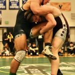 Thunder Mountain High Schools Denali Schijvens (a Juneau-Douglas High School: Yadaa.at Kalé junior) blocks a take down attempt by Ketchikan High School junior Paul Thompson during their 215-pound Division I championship match of the 2023 ASAA Region V wrestling tournament Saturday at TMHS. Thompson won 5-4. (Klas Stolpe/ For the Juneau Empire)