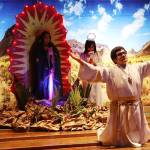Alejandro Lamas stretches his arms as a bishop during an Our Lady of Guadalupe play on Sunday at St. Pauls Catholic Church. In the background are Kimberly Valadez, playing the Virgin Mary, and Milagros Correa and Carlos Orozco as the angels. (Mark Sabbatini / Juneau Empire)