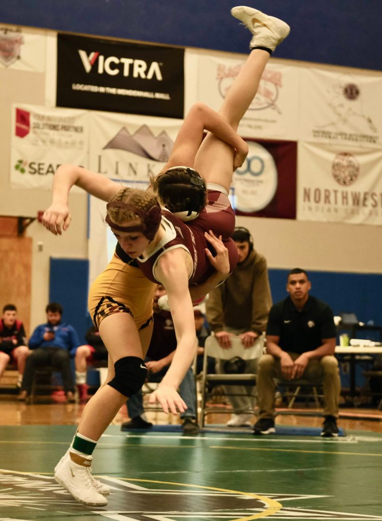 Hoonah junior Krista Howland takes down Ketchikan sophomore Summer Boling in the 120-pound girls championship match of the 2023 ASAA Region V wrestling tournament Saturday at Thunder Mountain High School. (Klas Stolpe/ For the Juneau Empire)