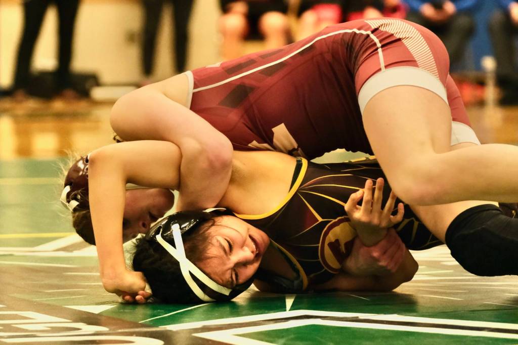 Ketchikan senior Julia Biagi works to pin Mt. Edgecumbe senior Makenna Beans in the 126-pound girls championship match of the 2023 ASAA Region V wrestling tournament Saturday at Thunder Mountain High School. Biagi won by pin. (Klas Stolpe/ For the Juneau Empire)