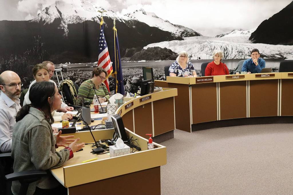 Lisa Daugherty (left), owner of Juneau Composts, explains her concerns about a proposed municipal composting facility during a Juneau Assembly meeting Monday night. (Mark Sabbatini / Juneau Empire)