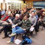 Dozens of people fill the Assembly chambers to testify during a Juneau Assembly meeting on Monday night. Most of the people spoke about either a proposed municipal compost facility, or an ordinance updating landslide and avalanche zone maps. (Mark Sabbatini / Juneau Empire)