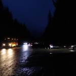 A school bus on Back Loop Road prepares to turn into the entrance to Mendenhall River Community School shortly before classes start on Wednesday morning. Juneau School District Superintendent Frank Hauser on Tuesday said he is asking state transportation officials to consider street lights and/or other safety improvements on the road following a collision last Thursday between a vehicle and three people walking to the school. (Mark Sabbatini / Juneau Empire)