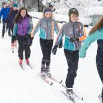 Juneau Nordic Ski Team members Erin Wallace, front, leads Aaron Blust and Anna Iverson in a pole-less skiing drill through fresh snow on Saturday, Nov. 18, 2017, at the Mendenhall Campgrounds. The team has been granted interim high school club status to compete in the Alaska School Activities Associations state championship for the first time in many years in February. (Nolin Ainsworth / Juneau Empire file photo)