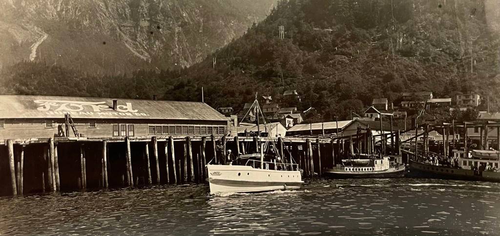 Juneau Motors promoted their Ford auto dealership in the 1920s with the carmakers logo painted on the building roof. (Photo ASL P469 Ruotsala Collection)