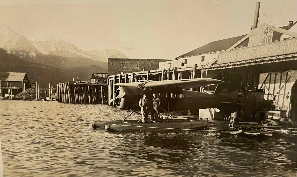 In 1937, flightseeing tours were offered on a Lockheed Vega. A large sign on the building advertises See the glaciers by air for $4.50. (Photo Alaska State Library PCA 337 Jarman Collection)