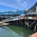 A summer 2023 sunny day shows off sparkling water and floating docks below Merchants Wharf. (Photo by Laurie Craig)