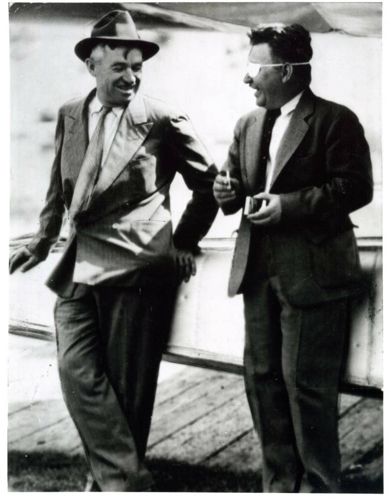 Humorist Will Rogers and pilot Wiley Post enjoy a relaxed moment together. (Courtesy Oklahoma Historical Society)