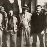 Five famous men stand together on a floatplane hangar deck on Aug. 8, 1935. From left to right: Juneau Mayor Izzy Goldstein, Pilot Wiley Post, Novelist Rex Beach, Pilot Joe Crosson, and Cowboy Philosopher Will Rogers. (Alaska State Library Ordway photo PCA-87-2631)