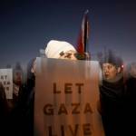 Demonstrators shut down the Spring Garden Street Bridge during a Pro-Palestinian rally on Thursday in Philadelphia. More than 200 people gathered to call for a ceasefire in Gaza. (AP Photo/Joe Lamberti)