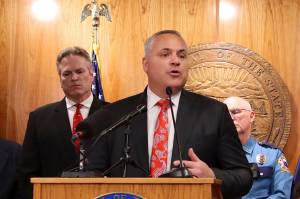 Mark Sabbatini / Juneau Empire
Alaska Attorney General Trig Taylor (foreground) discusses litigation the state Department of Law is involved with during Gov. Mike Dunleavys (left background) unveiling of his proposed budget during a press conference Thursday at the Alaska State Capitol.