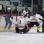 Juneau-Douglas High School: Yadaa.at Kalé goalie Caleb Friend watches the puck get past him during Saturday nights game against Palmer High School at Treadwell Arena. (Mark Sabbatini / Juneau Empire)