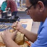 Doug Chilton works on a canoe journey carving at Juneau-Douglas High School: Yadaa.at Kalé in February of 2016. (Courtesy of the Central Council of the Tlingit and Haida Indian Tribes of Alaska)