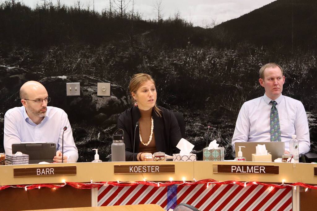 Juneau City Manager Katie Koester (center) discusses options for additional office space for city workers during a Juneau Assembly Committee of the Whole meeting on Monday night as Deputy City Manager Robert Barr (left) and City Attorney Robert Palmer listen. (Mark Sabbatini / Juneau Empire)