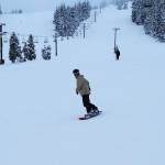 Some of the first snowboarders and skiers at Eaglecrest Ski Area complete their first run on opening day Wednesday morning. (Mark Sabbatini / Juneau Empire)