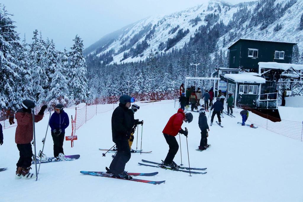 A line at the Ptarmigan lift gains new arrivals shortly after Eaglecrest Ski Area begins operating for the 2023-24 ski season Wednesday morning. (Mark Sabbatini / Juneau Empire)