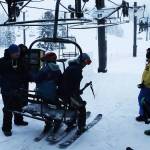 A pair of skiers are among the first to board the Ptarmigan lift on the first day of the 2023-24 season at Eaglecrest Ski Area shortly after 9 a.m. Wednesday. (Mark Sabbatini / Juneau Empire)