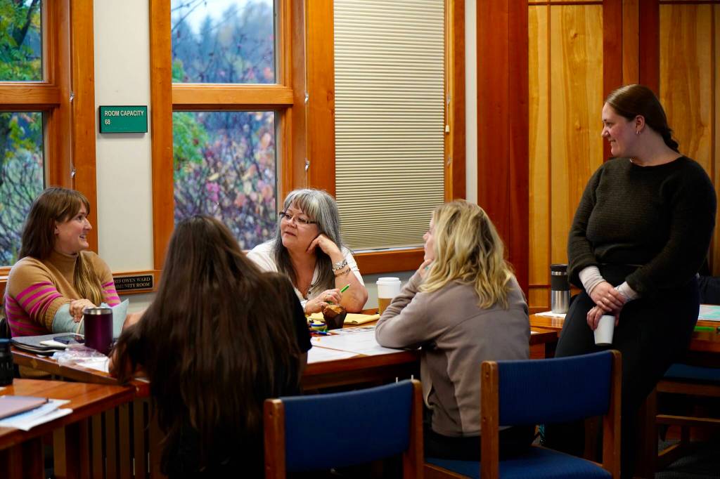 Chilkoot Indian Associations and Spruce Roots Business Basics for Artists class in Haines discusses pricing art with Izzy Haywood, Spruce Roots program manager for events and facilitation, guiding the conversation. (Photo by Shaelene Grace Moler,)