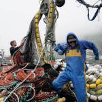 Salmon fisherman stack their nets June 22 in Kodiak. (AP Photo/Joshua A. Bickel, File)